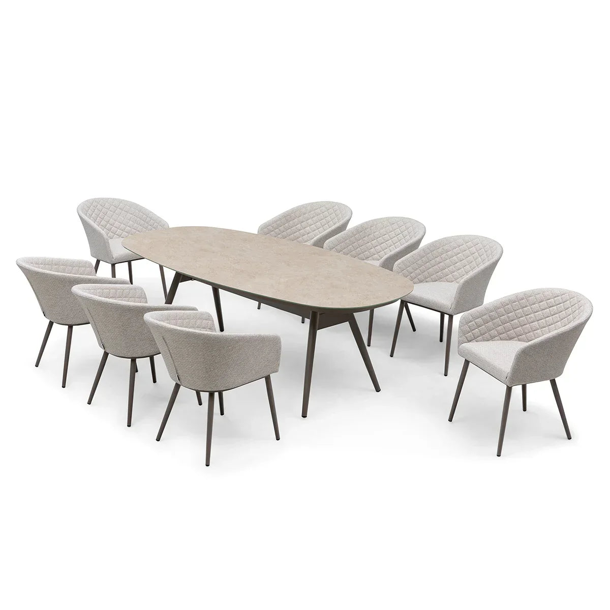 Oval dining table with beige stone top and eight modern quilted armchairs