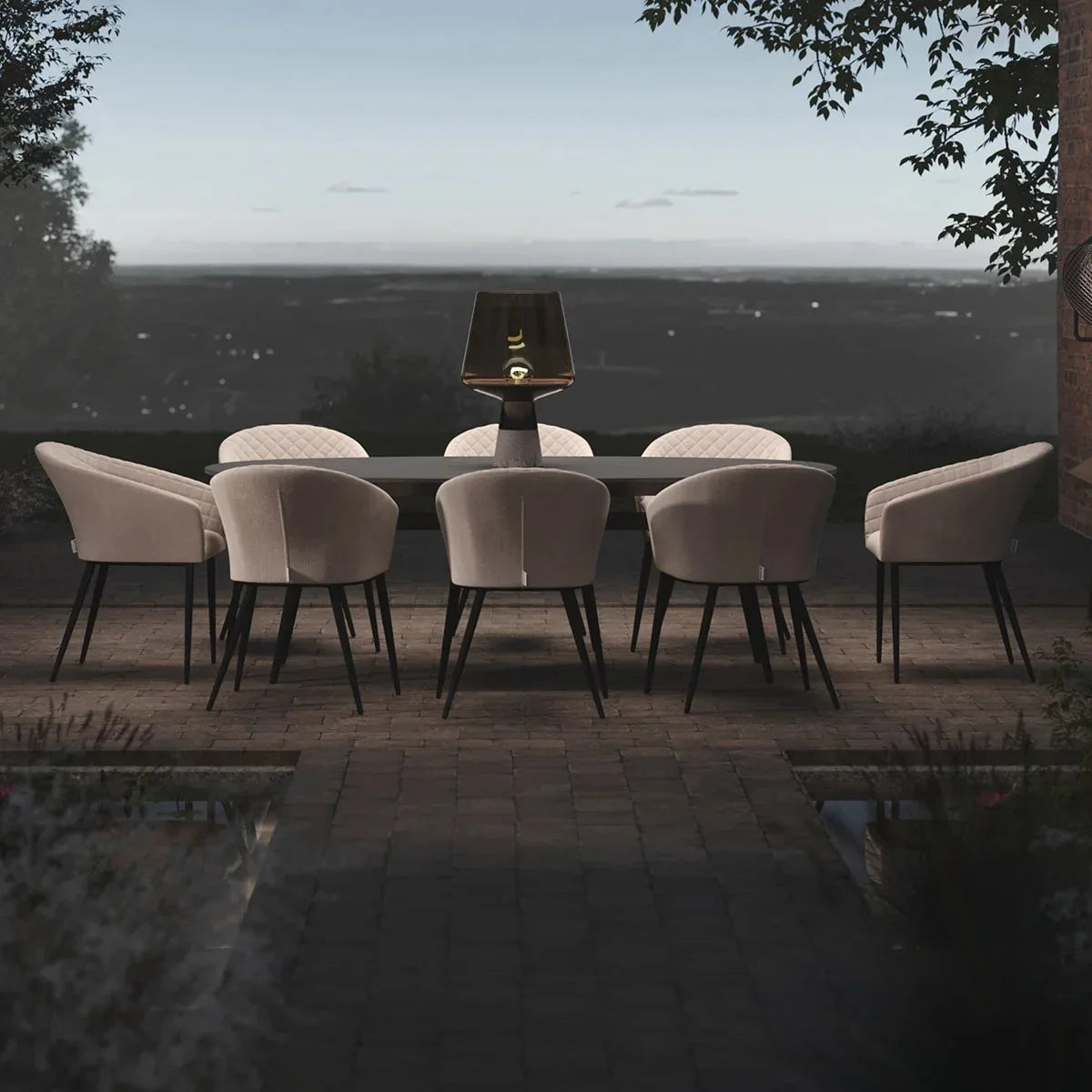 Outdoor dining set with eight beige upholstered chairs around a rectangular table at dusk