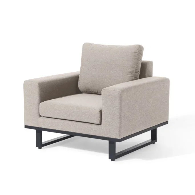 Beige fabric armchair with black metal legs and wide cushioned seat, angled front view
