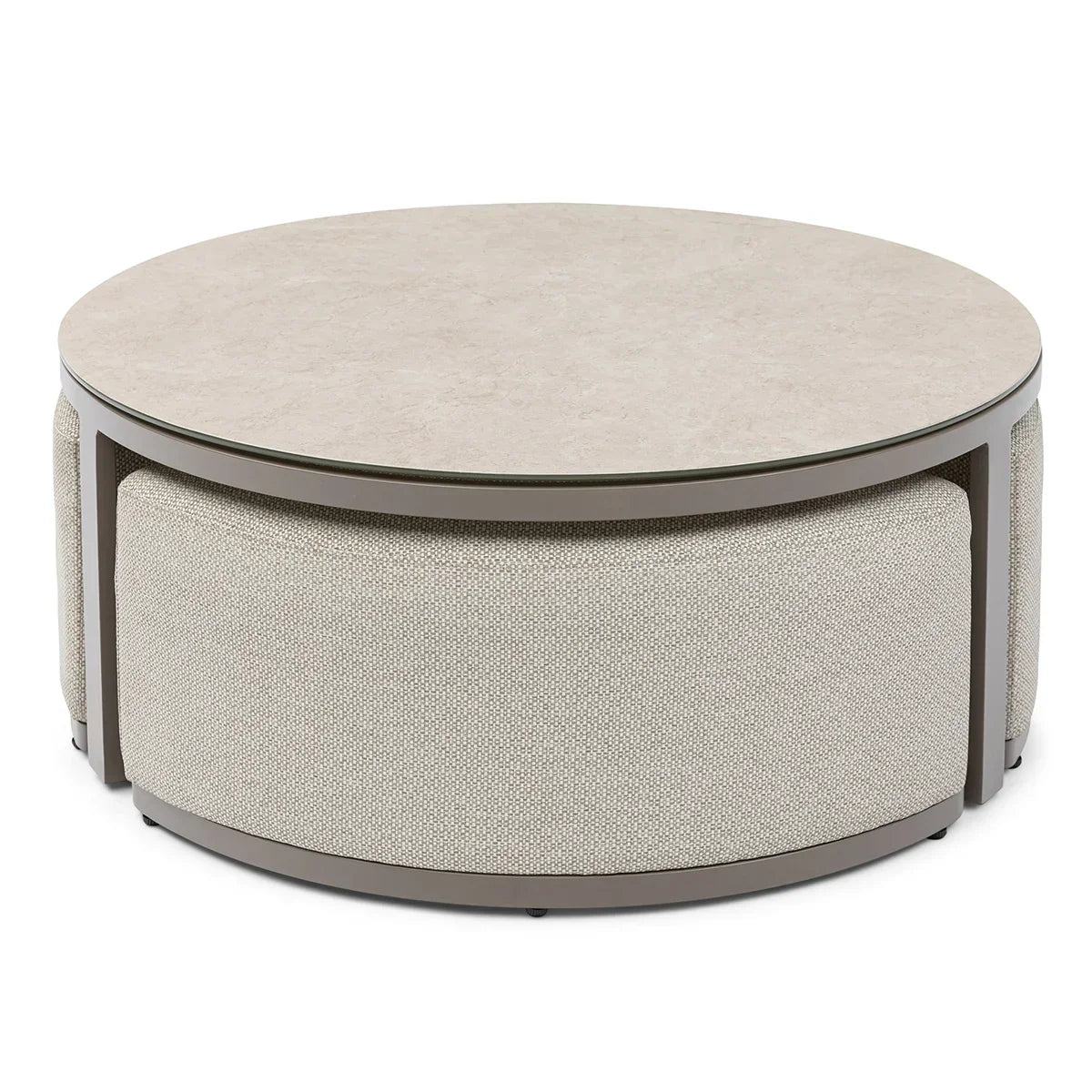Round coffee table with light stone top and fabric upholstered base in neutral tones