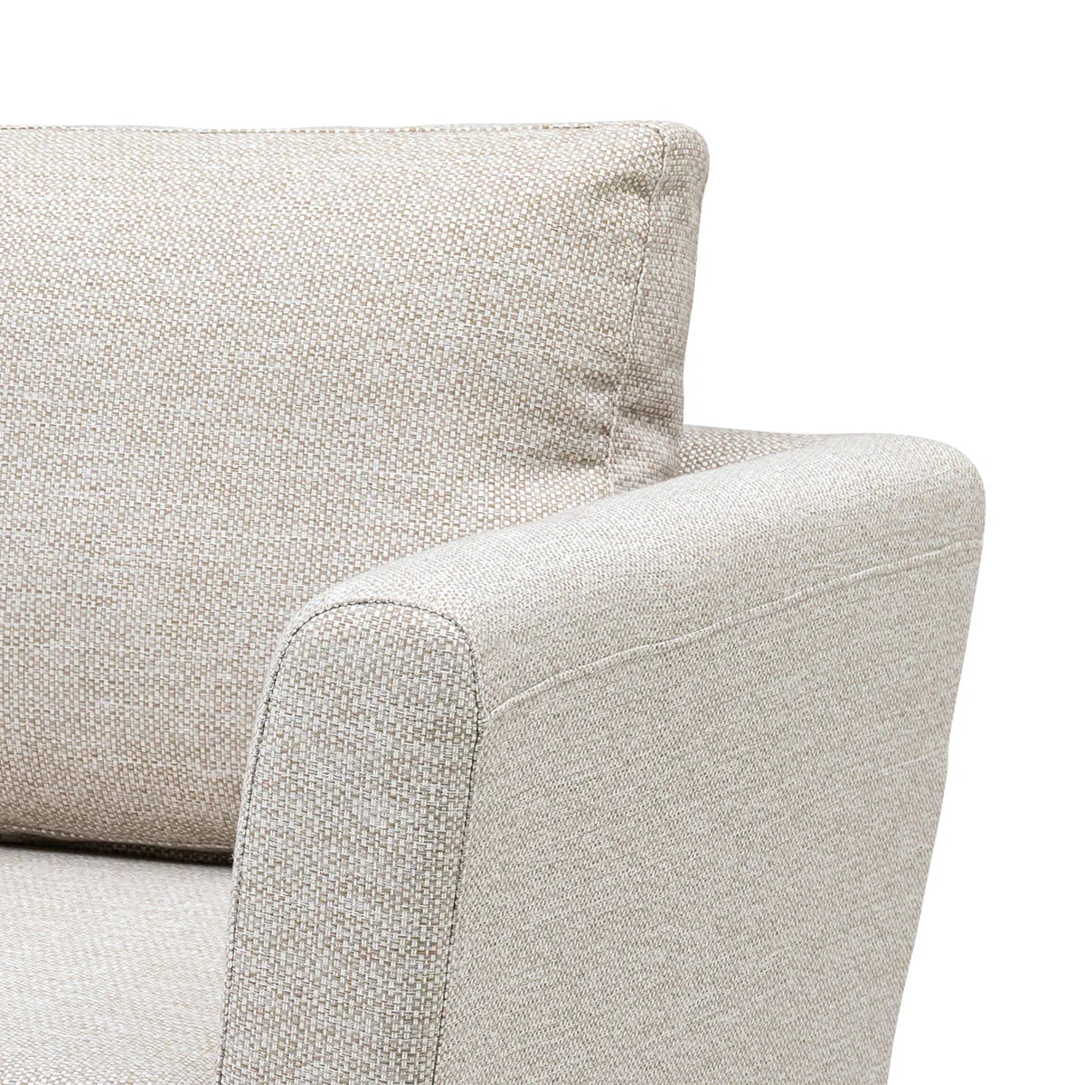 Close-up of beige fabric sofa armrest and backrest with textured upholstery