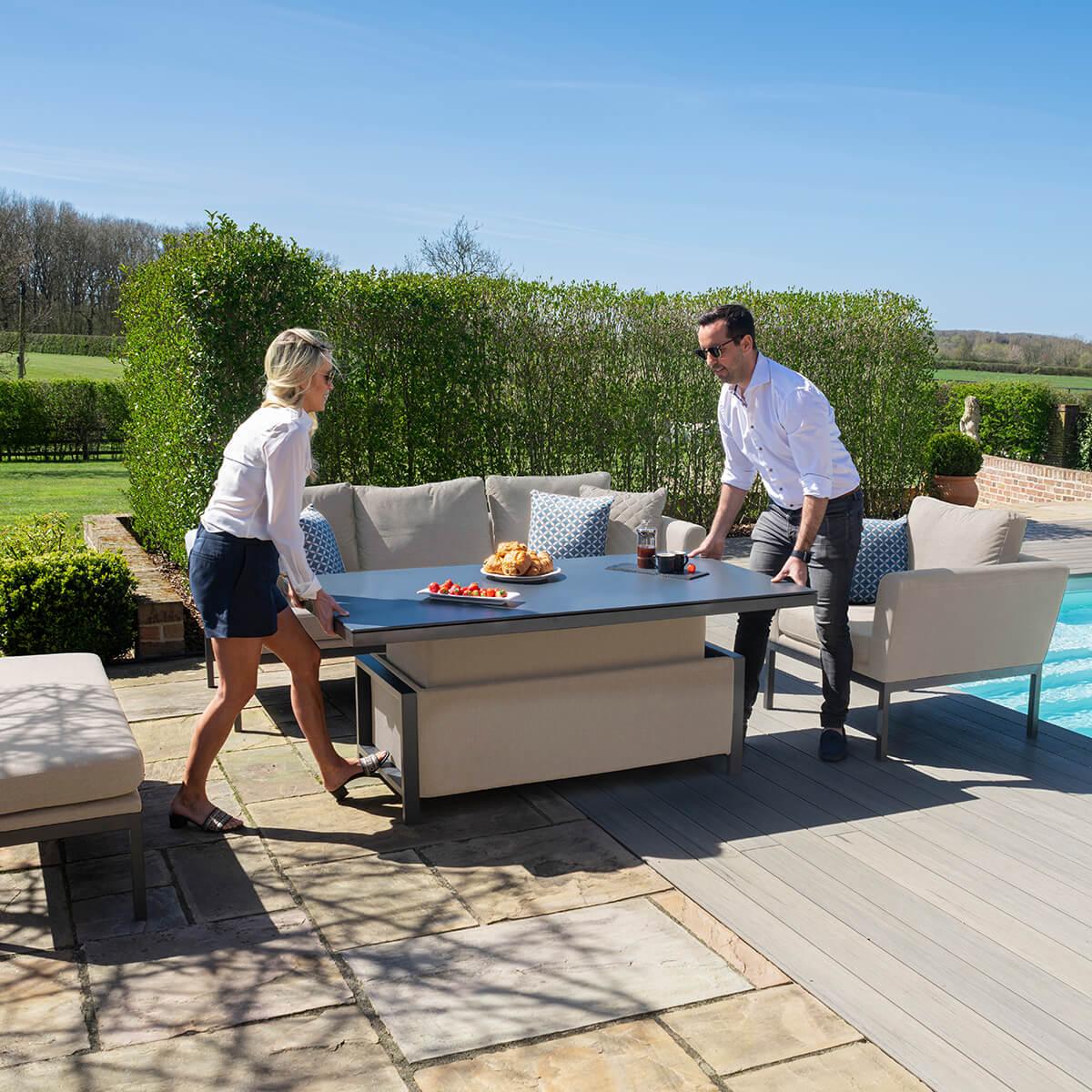 Outdoor fabric sofa set with adjustable dining table on patio beside swimming pool