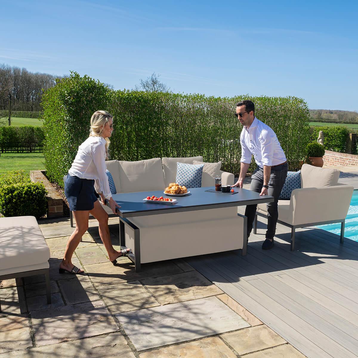 Outdoor garden sofa set with adjustable dining table and beige cushions on patio