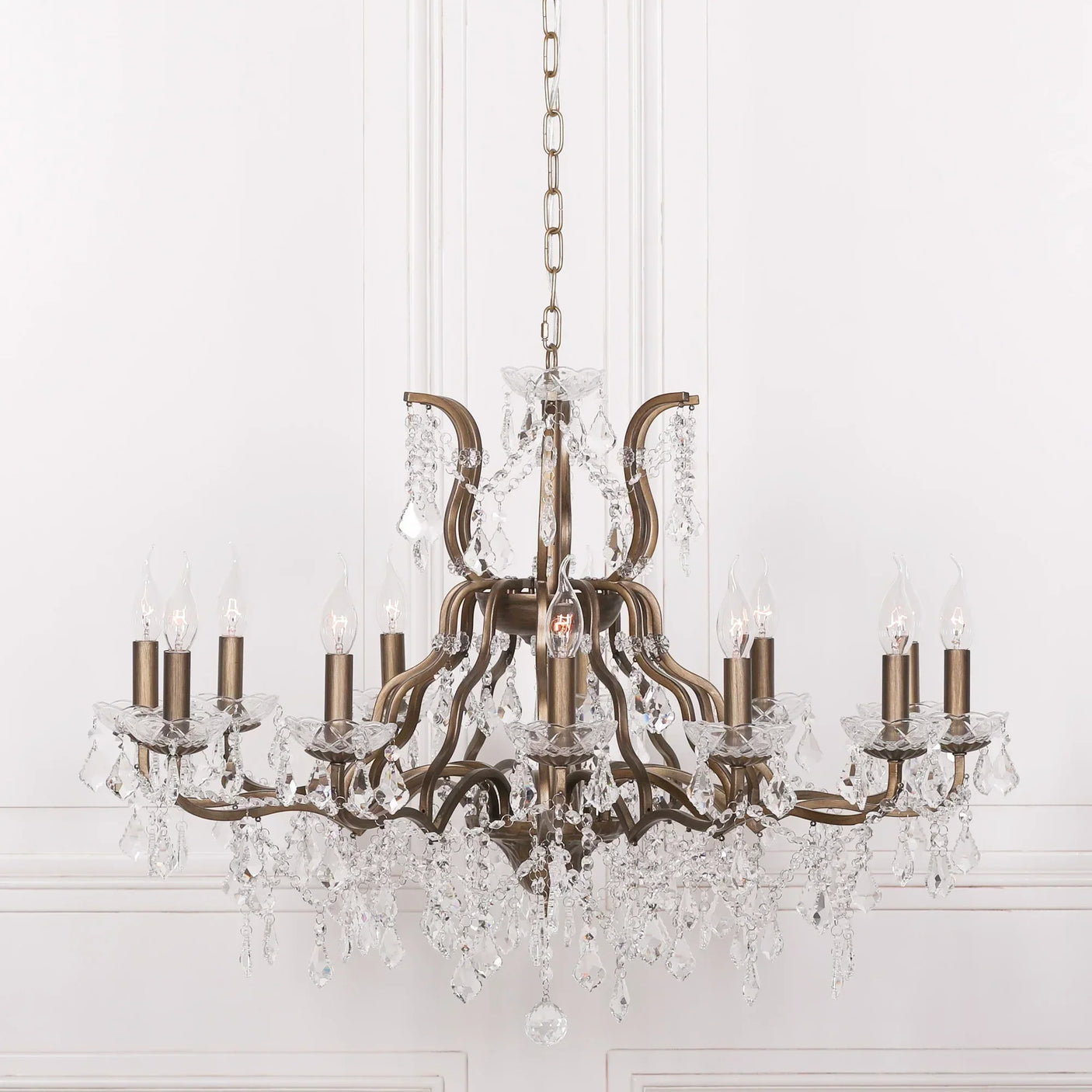 Bronze crystal chandelier with 12 candle-style bulbs and hanging glass pendants