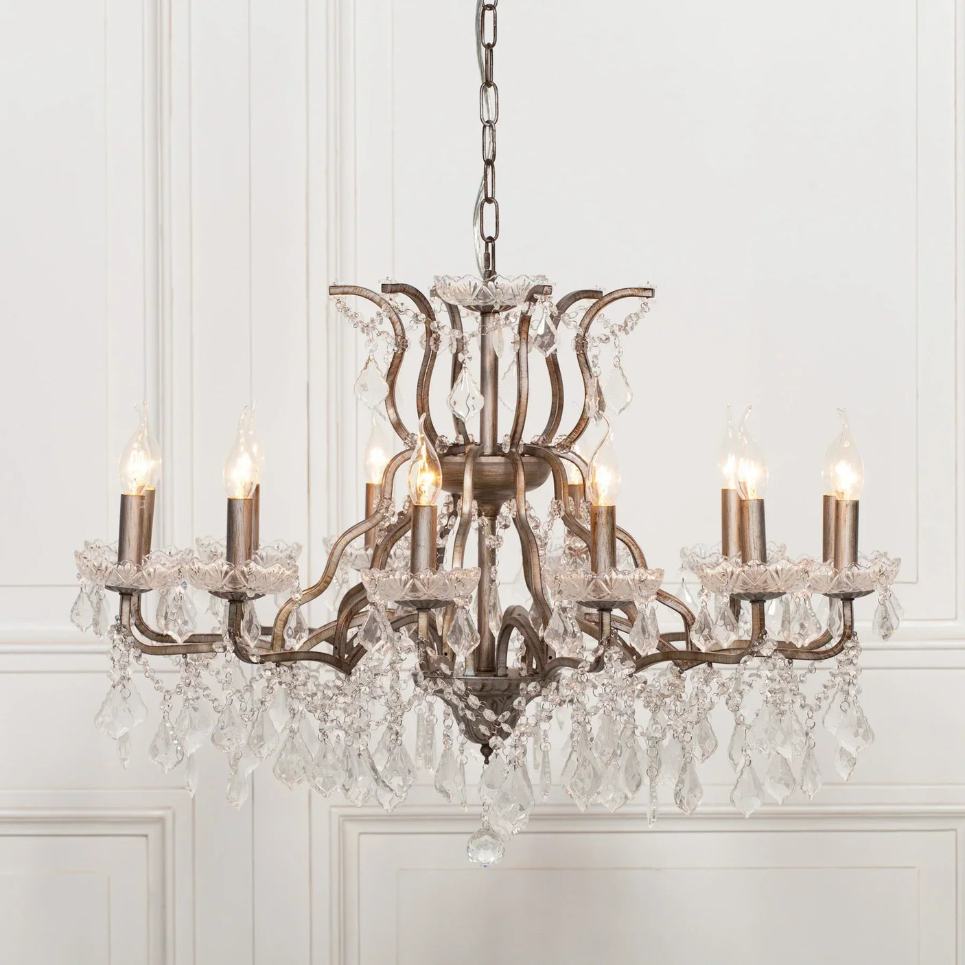 Eight arm crystal chandelier with bronze finish and hanging glass droplets