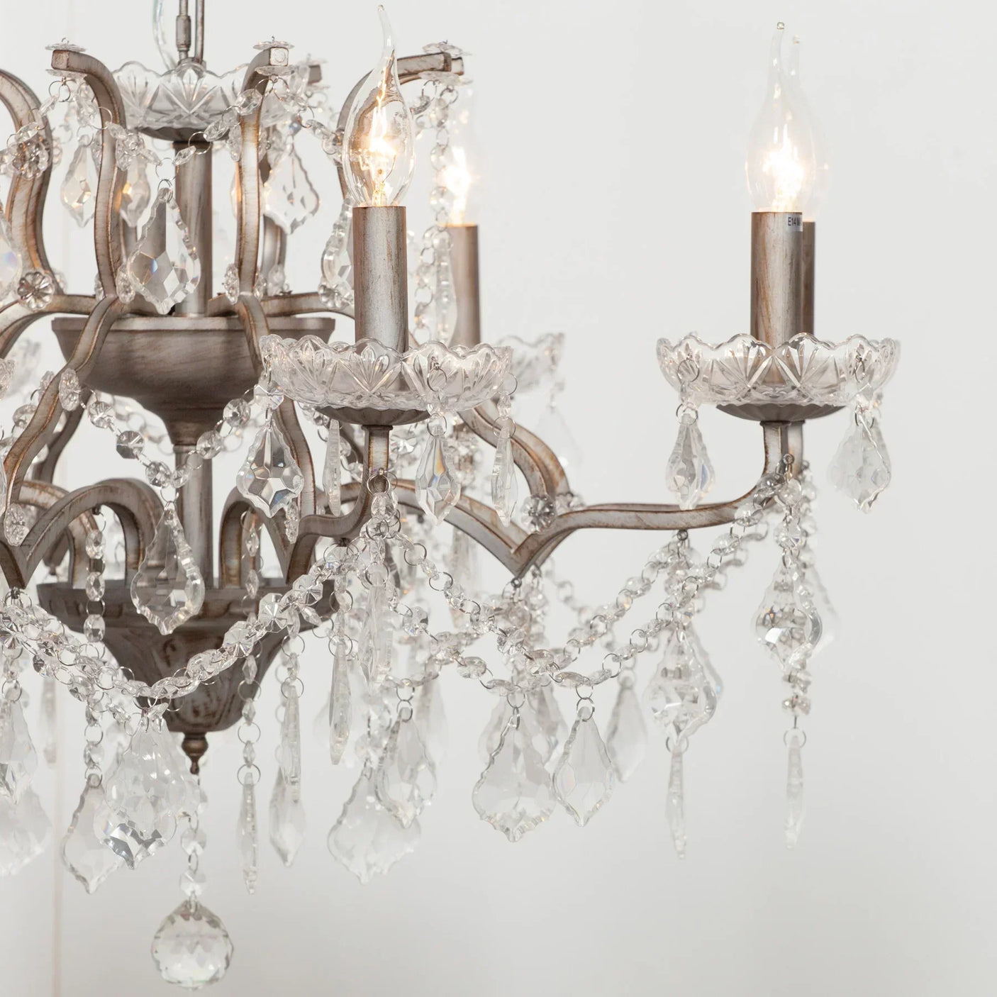 Glass crystal chandelier with vintage finish and ornate hanging droplets