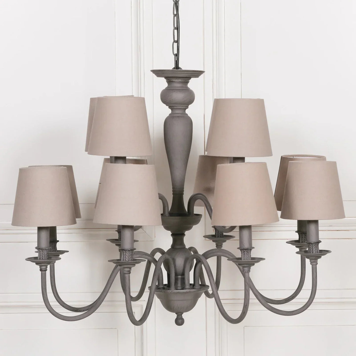Eight arm grey chandelier with beige fabric shades and decorative metal frame