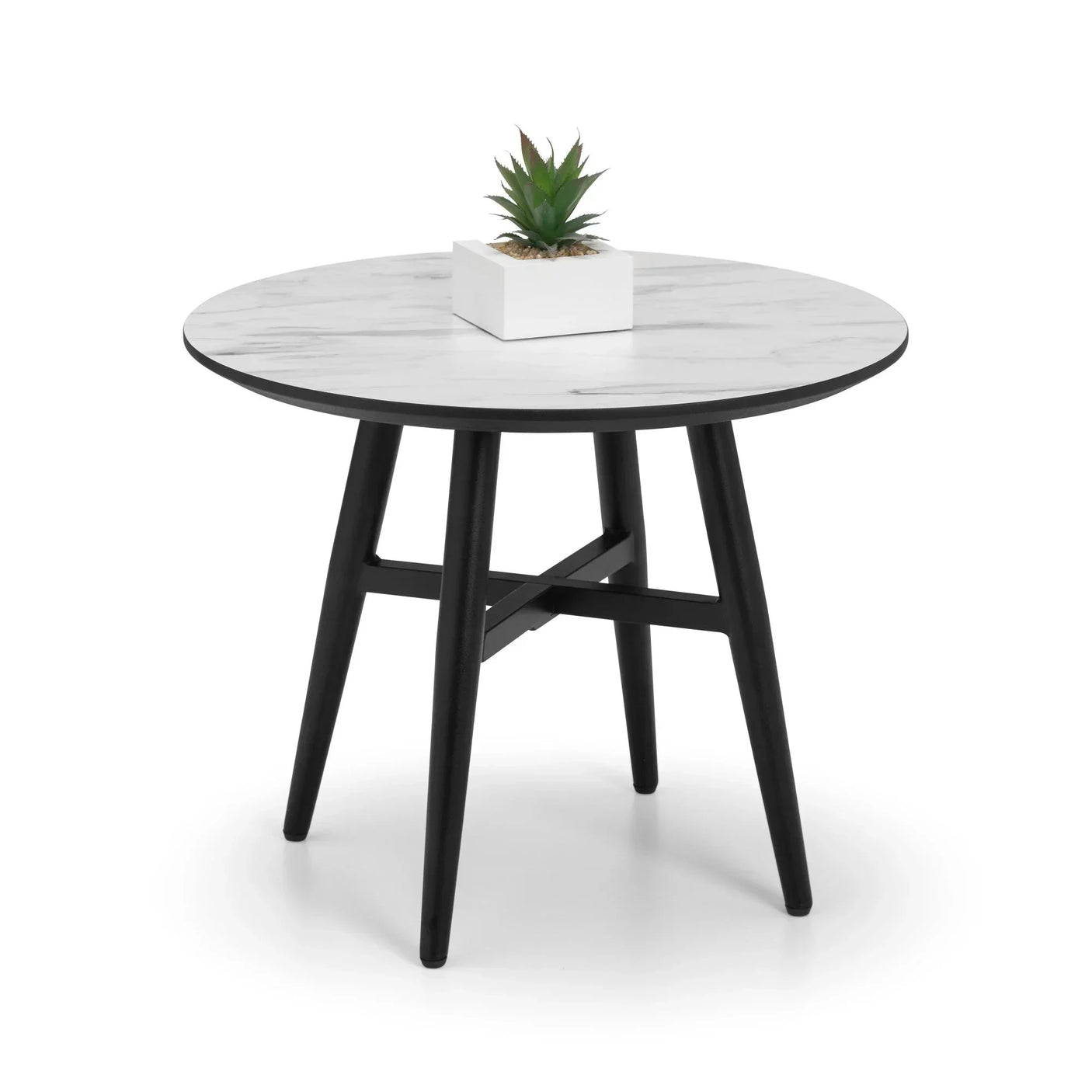 Round marble top dining table with black legs and small plant centerpiece