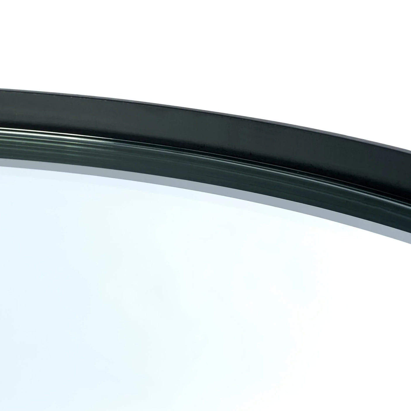 Close up of round glass coffee table with black metal frame detail