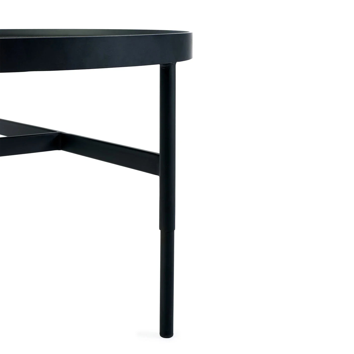 Black glass coffee table corner with metal frame and slim round leg detail