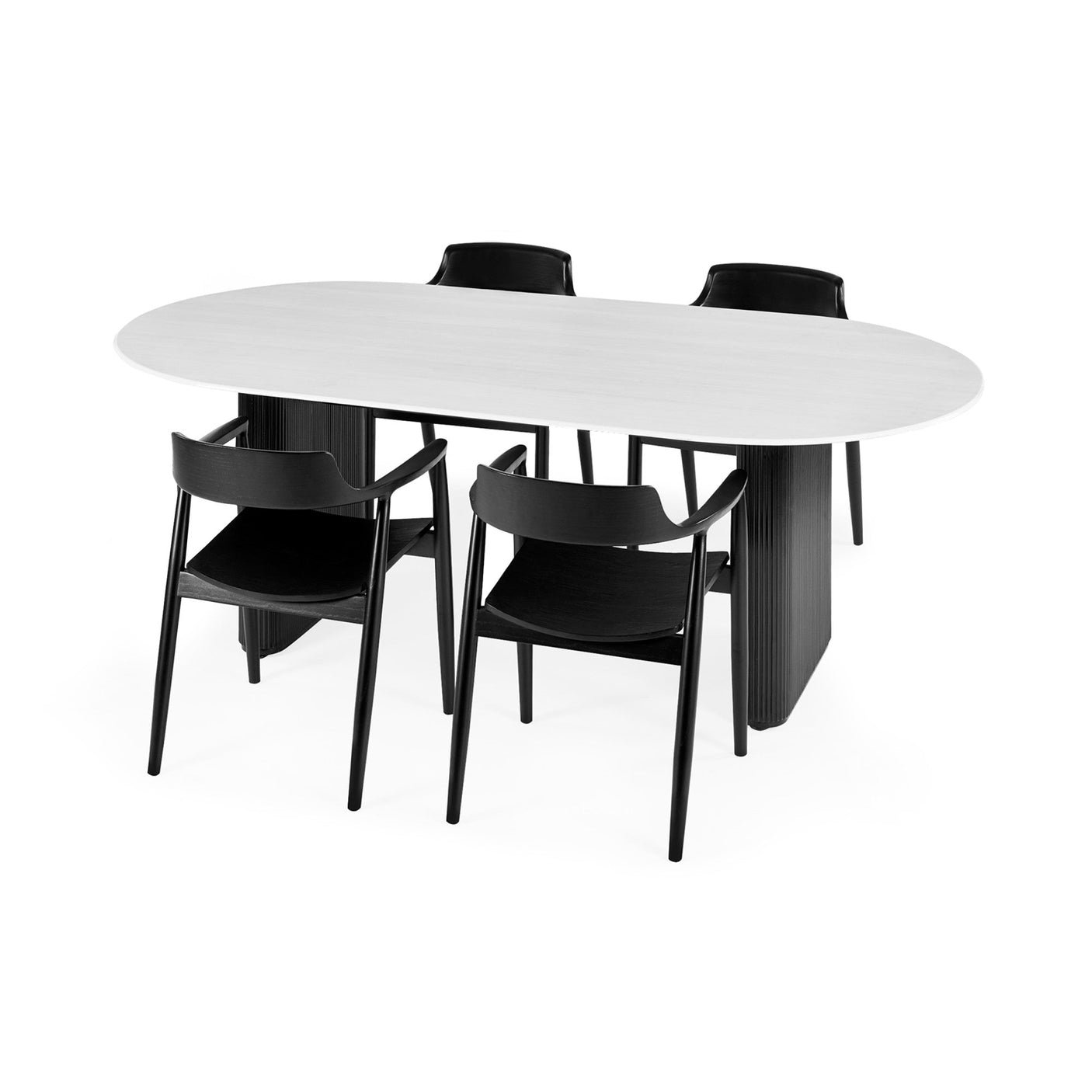 Four black wooden dining chairs with curved backrests around white oval dining table with black pedestal legs.
