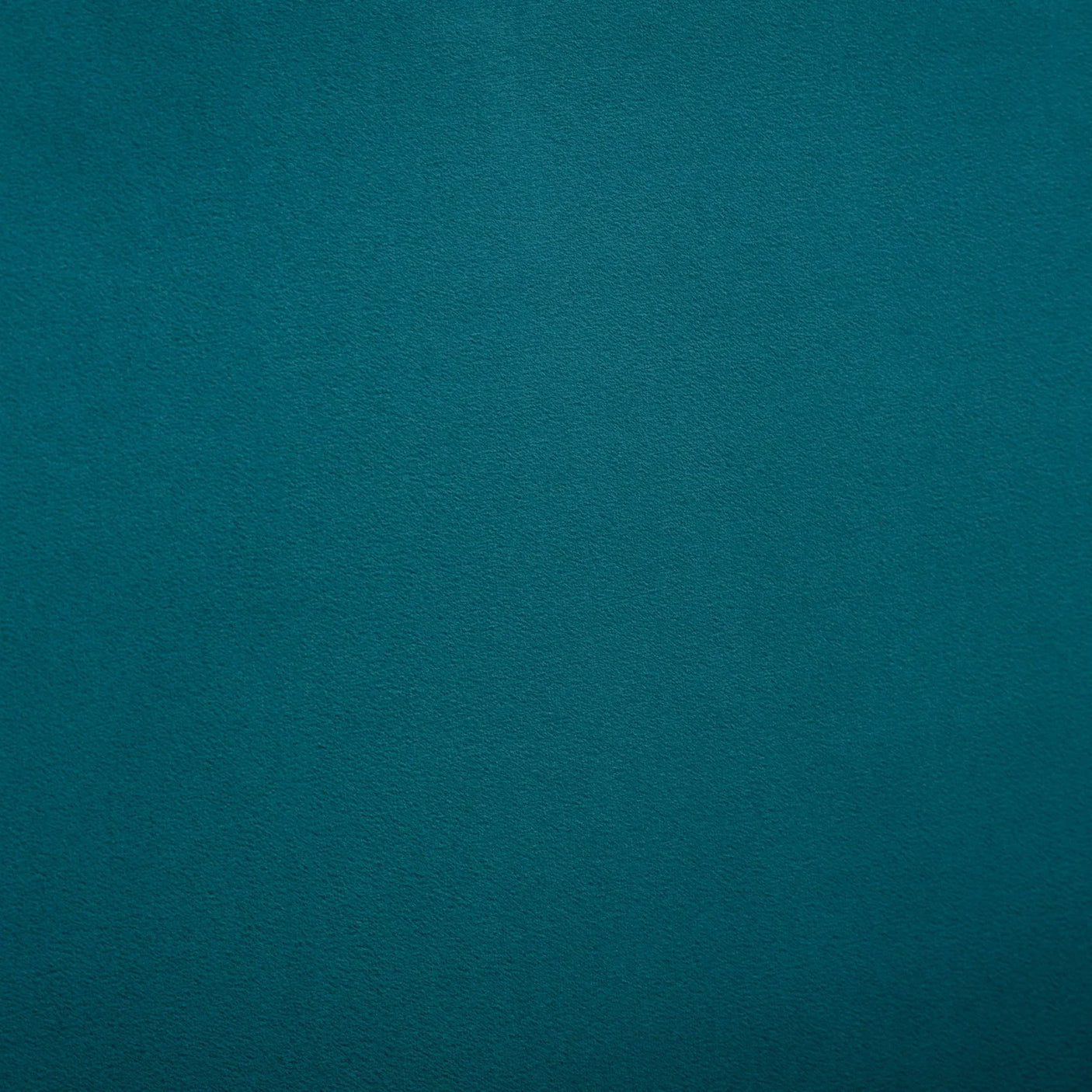 Close-up of teal velvet fabric texture for king bed upholstery