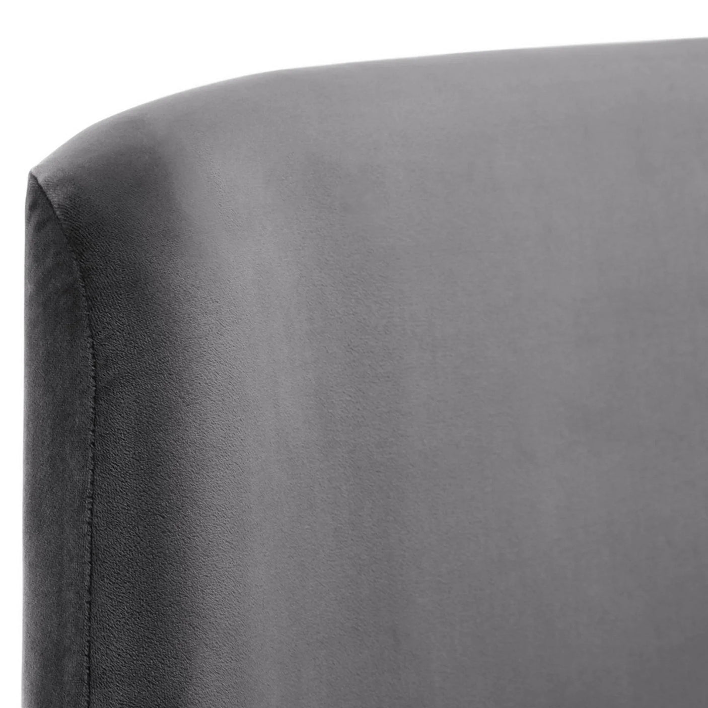 Close detail of grey velvet king bed headboard upholstery and stitching