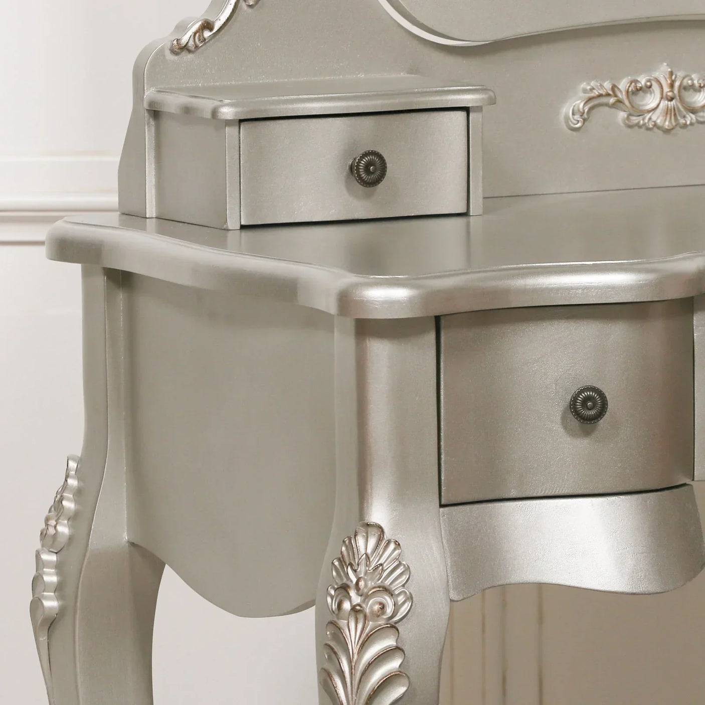 Silver dressing table corner with ornate carved leg and two drawers