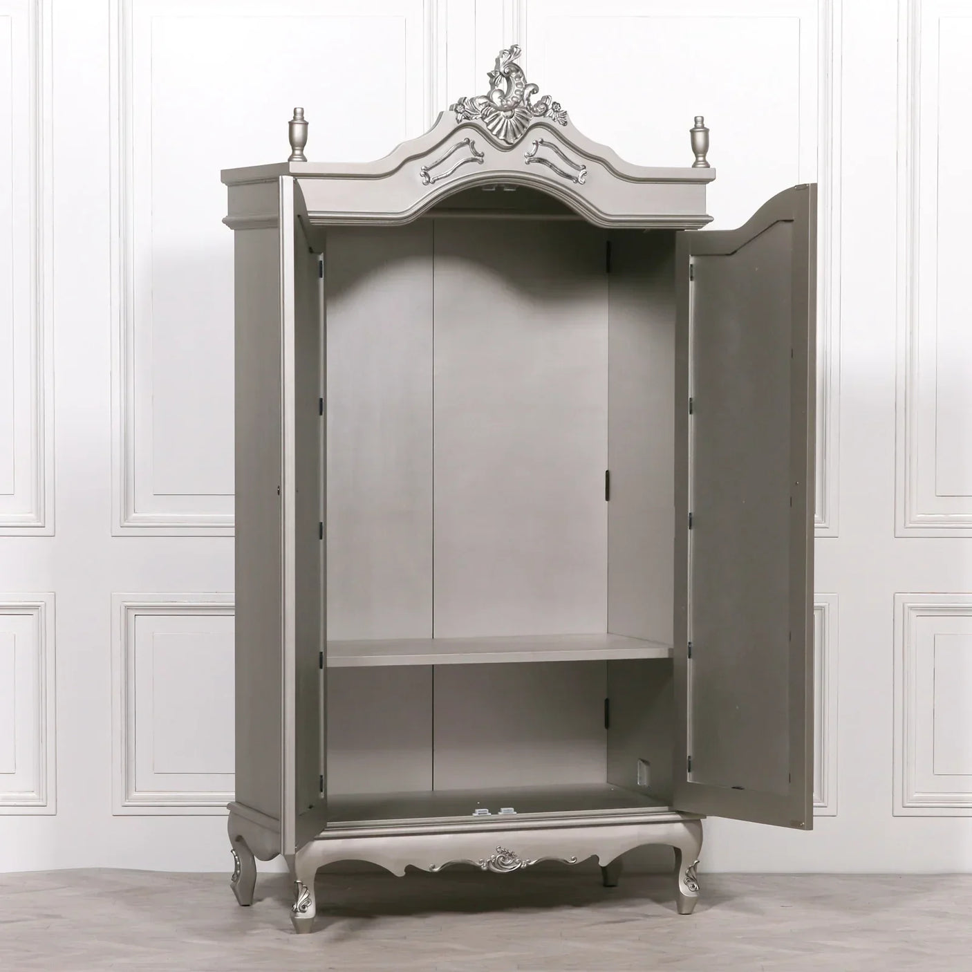 Grey wooden wardrobe with ornate detailing, open double doors, single internal shelf