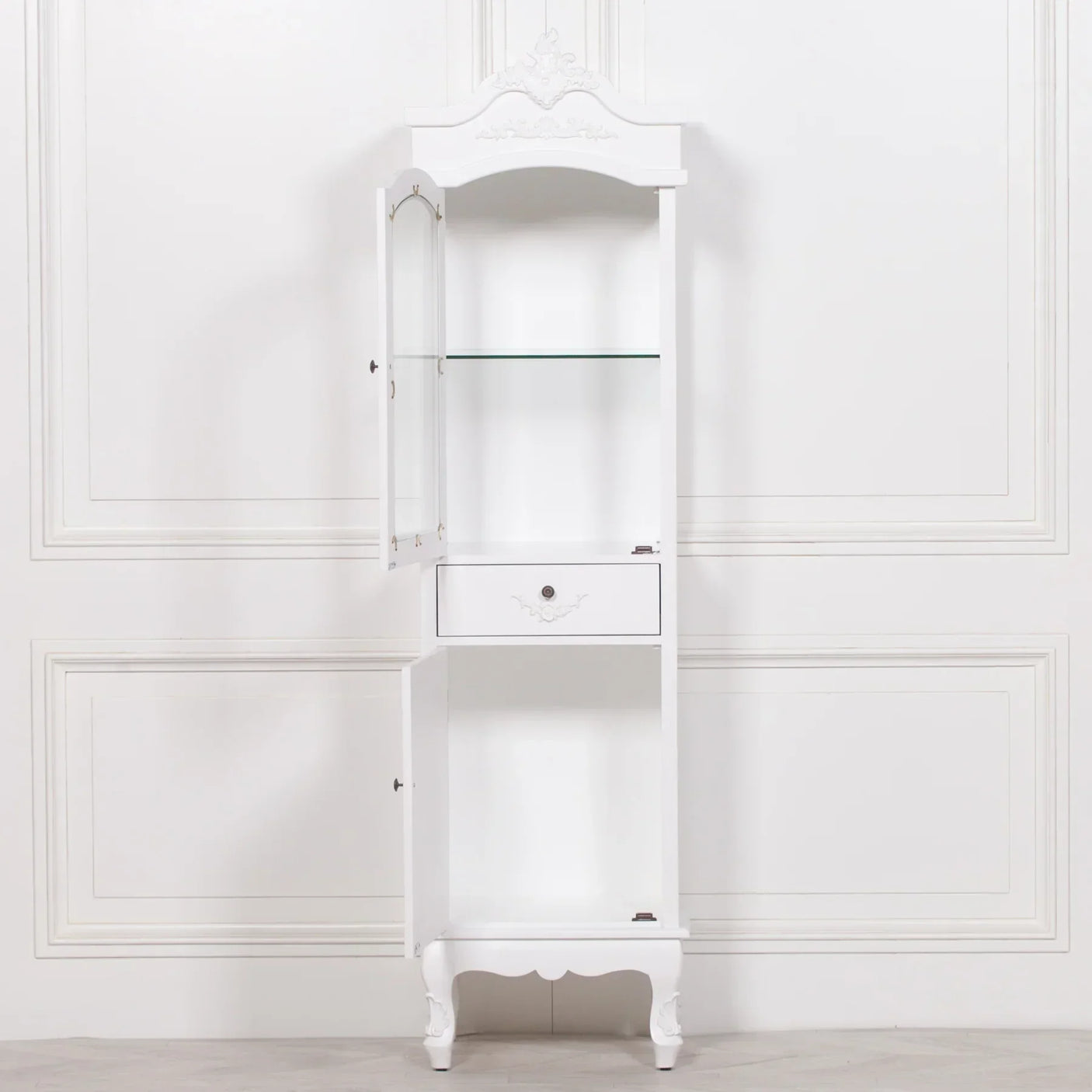 White display cabinet with glass shelf, ornate drawer, doors open, classic carved detail
