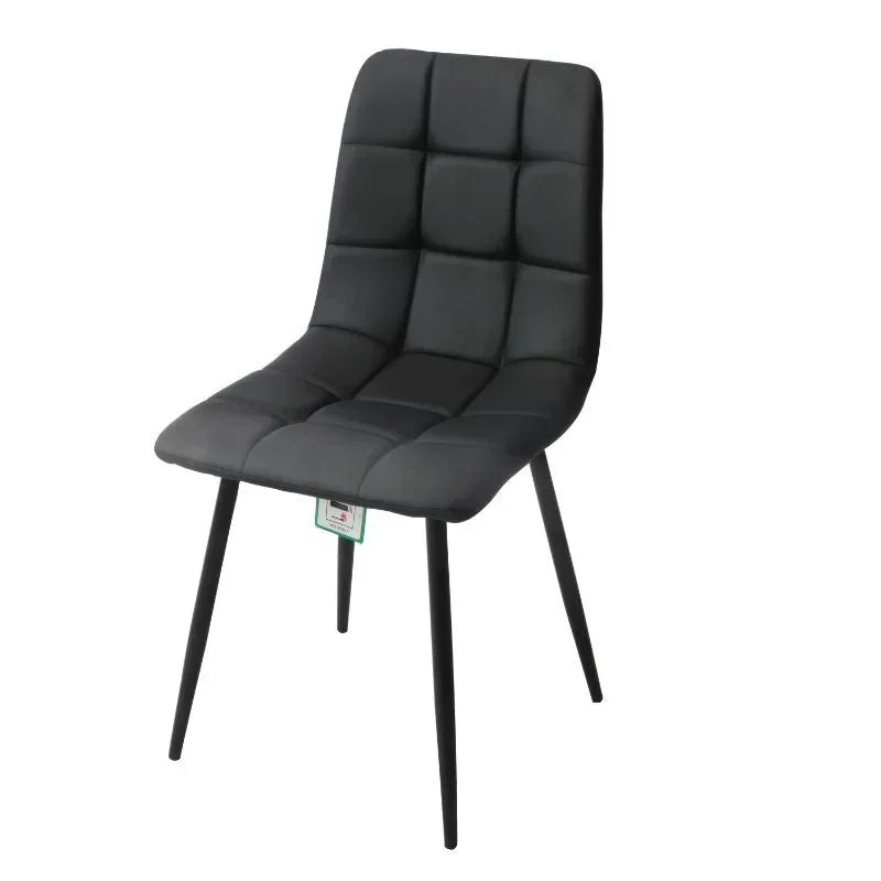 Black PU dining chair with quilted seat and back, slim metal legs, side angle view