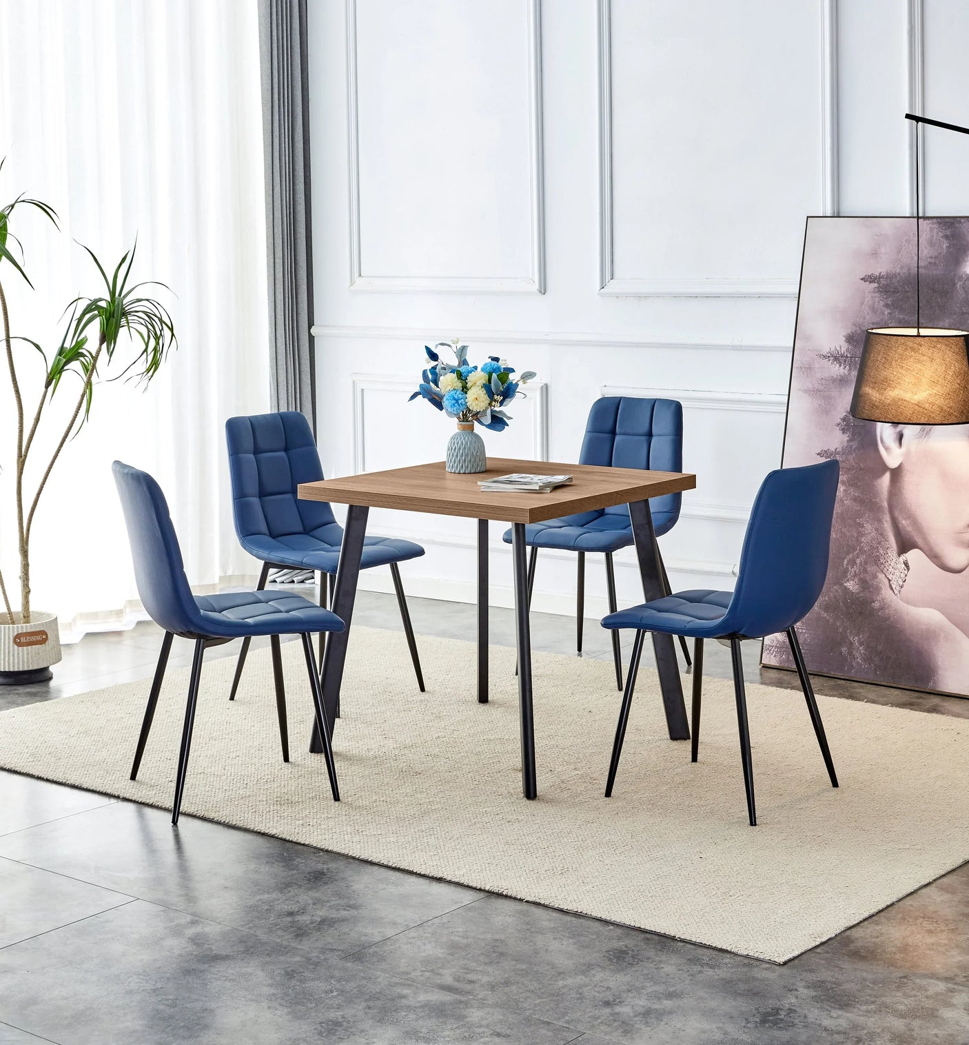 Walnut square dining table with blue PU chairs on neutral rug in modern dining room