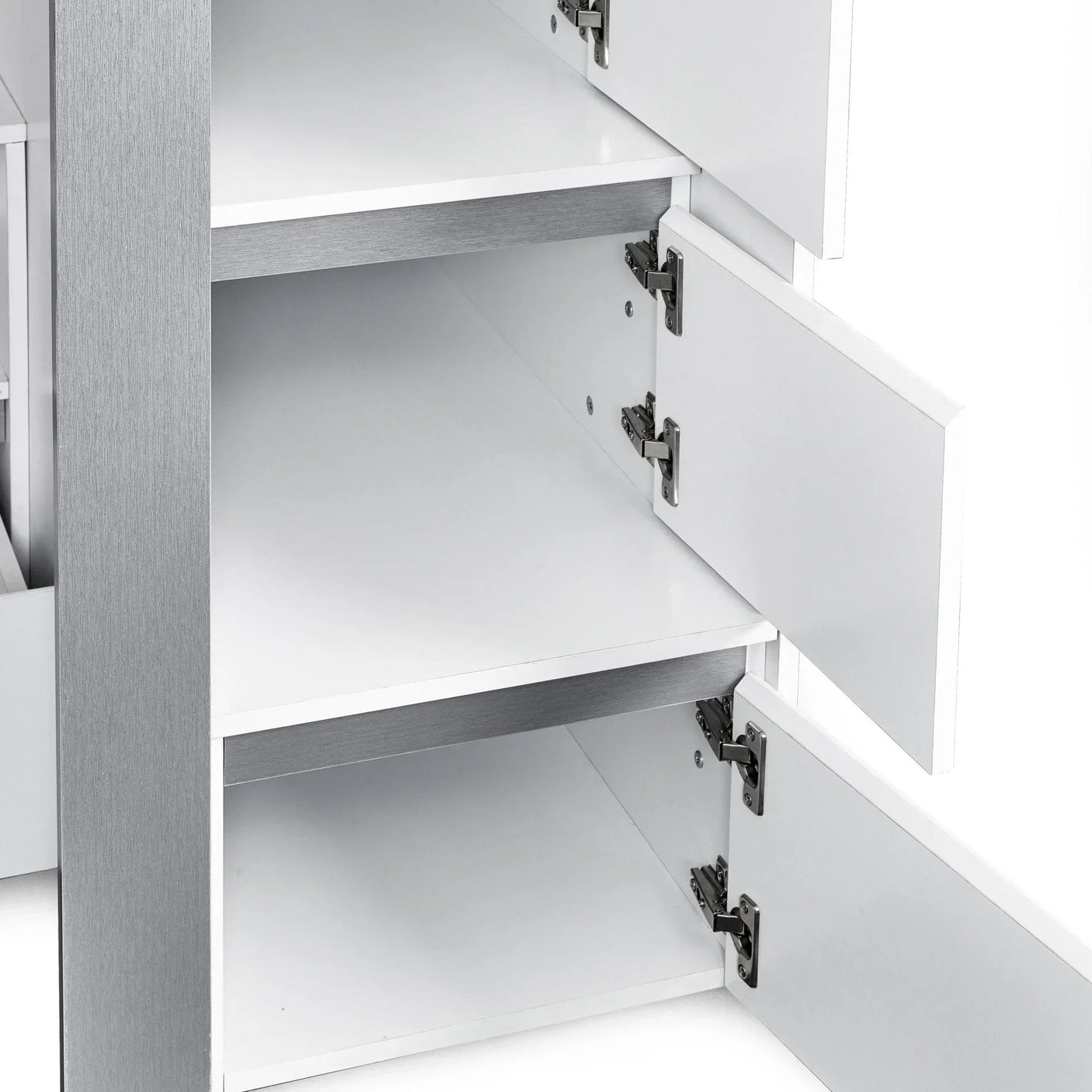 White storage cabinet with open doors showing interior shelving and silver hinge details