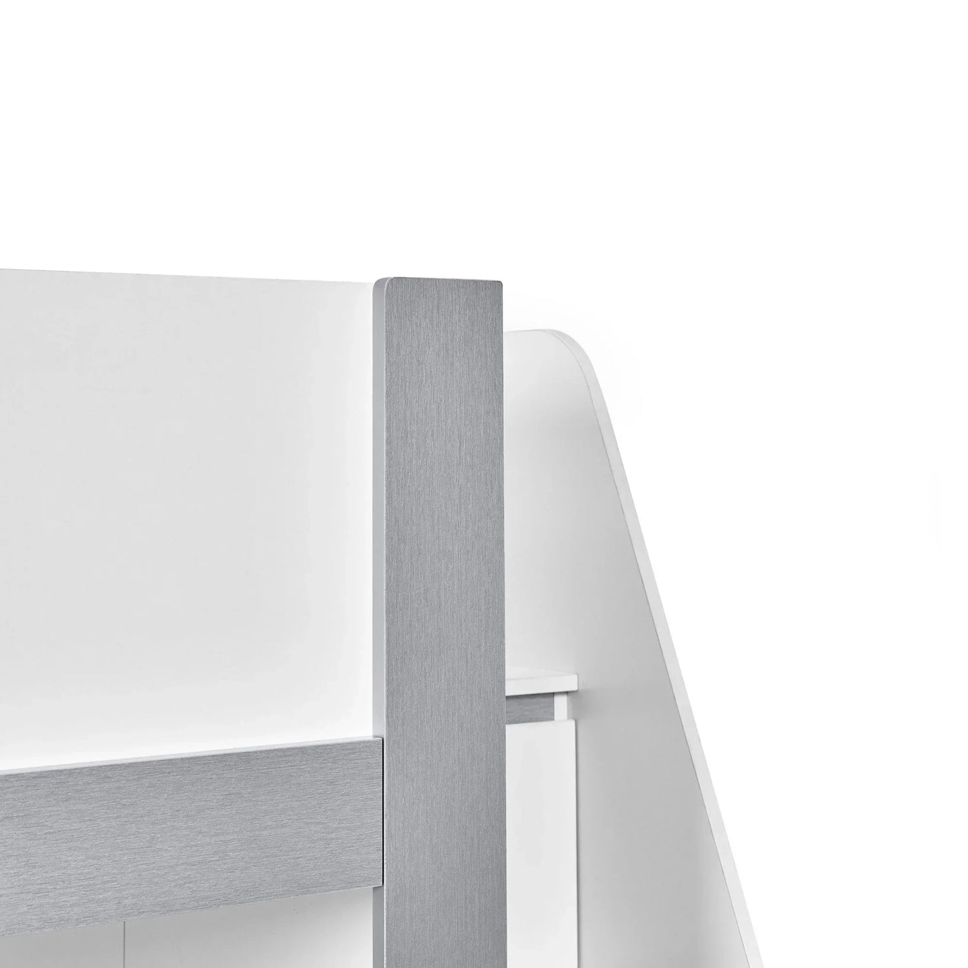Close-up of modern bed frame corner with brushed metal post and white finish panel