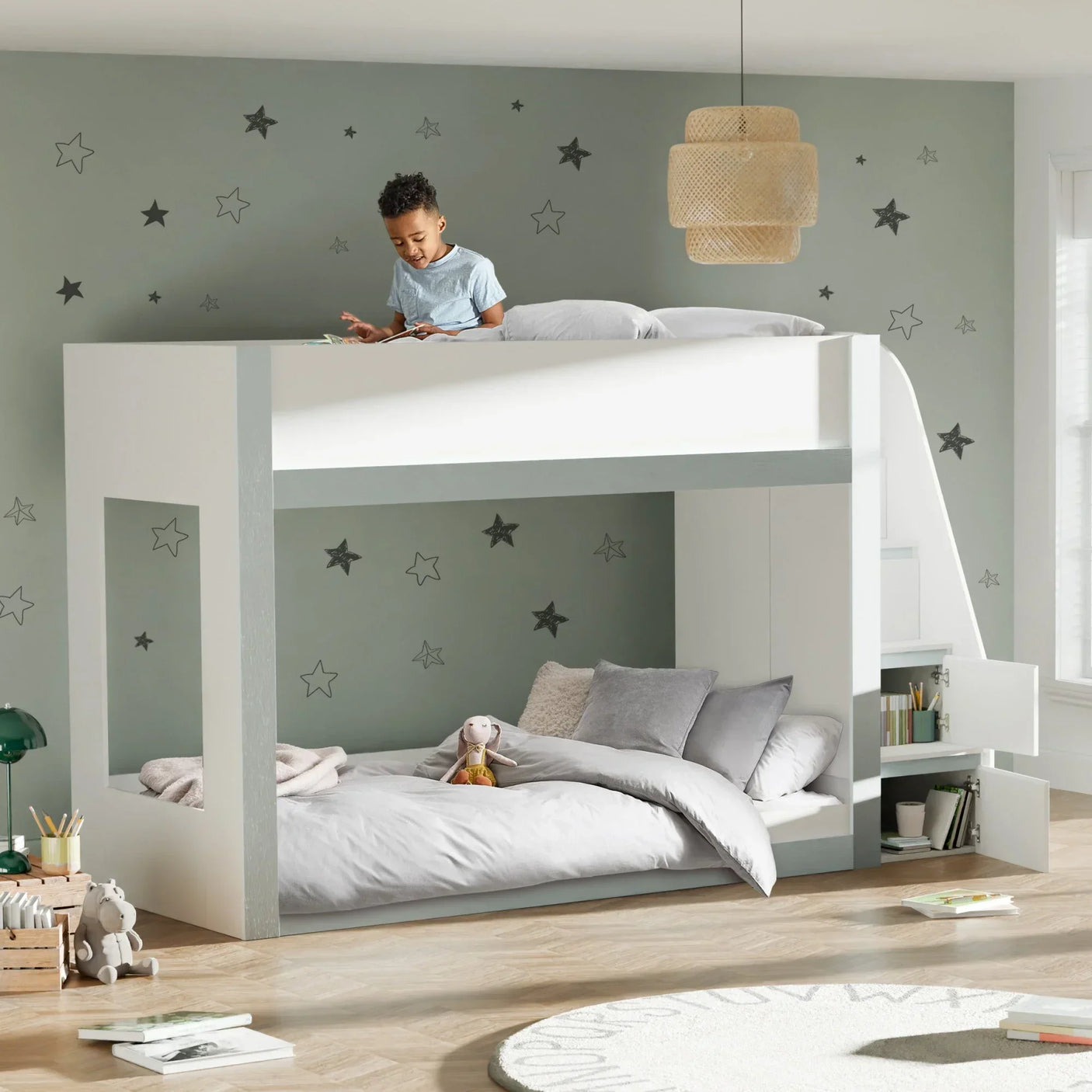 White wooden bunk bed with storage shelves and ladder in modern children's bedroom