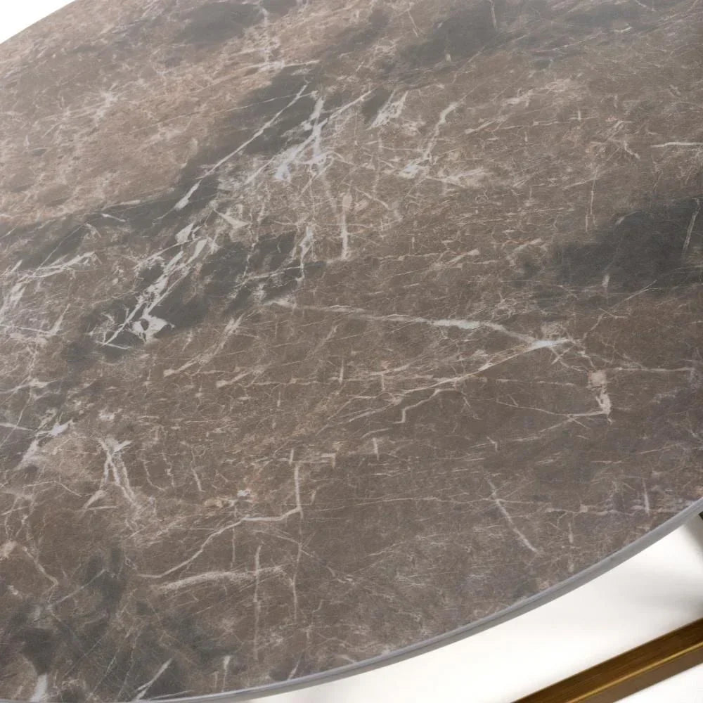 Round brown marble coffee table top with white vein detailing, partial gold metal frame
