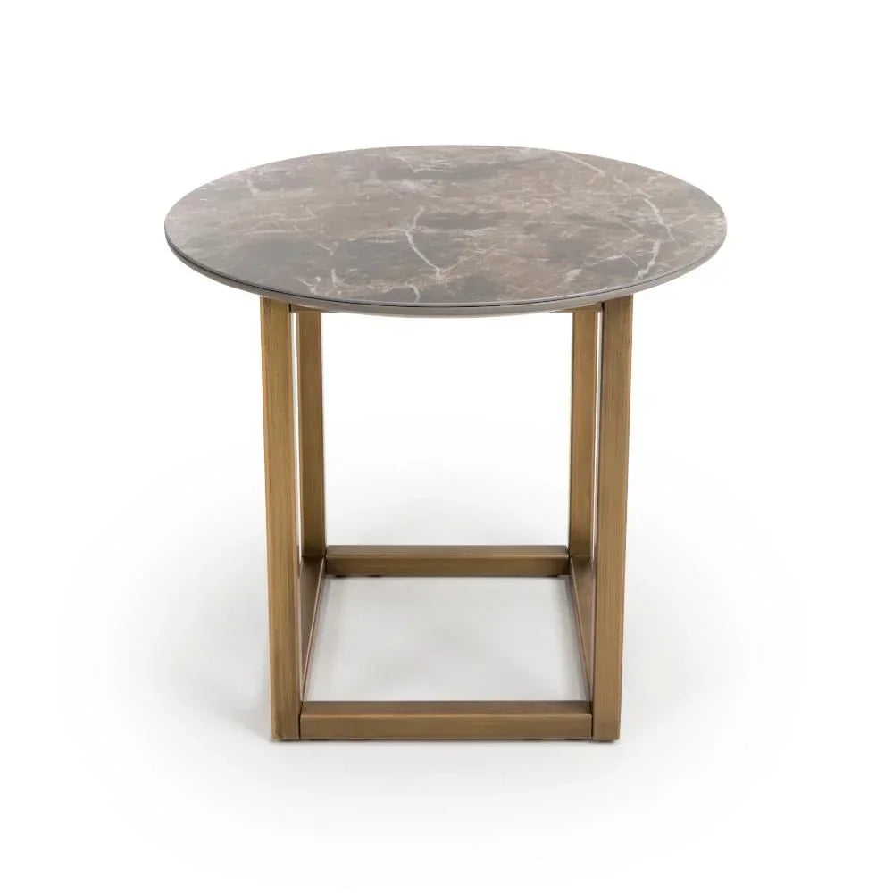 Round marble side table with bronze metal base, front view on white background