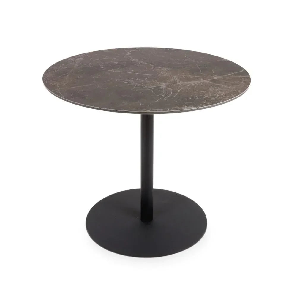 Round marble dining table with black metal pedestal base on white background