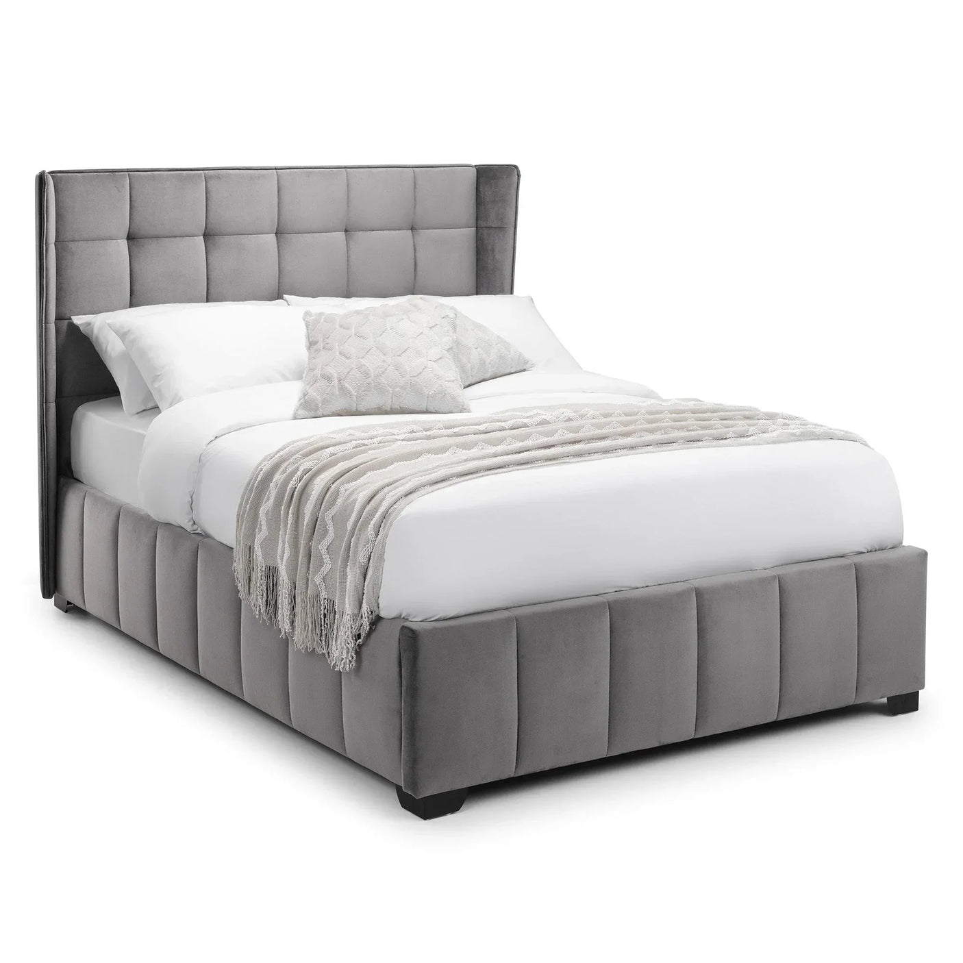 Grey upholstered bed frame with panelled headboard, dressed with white bedding and throw