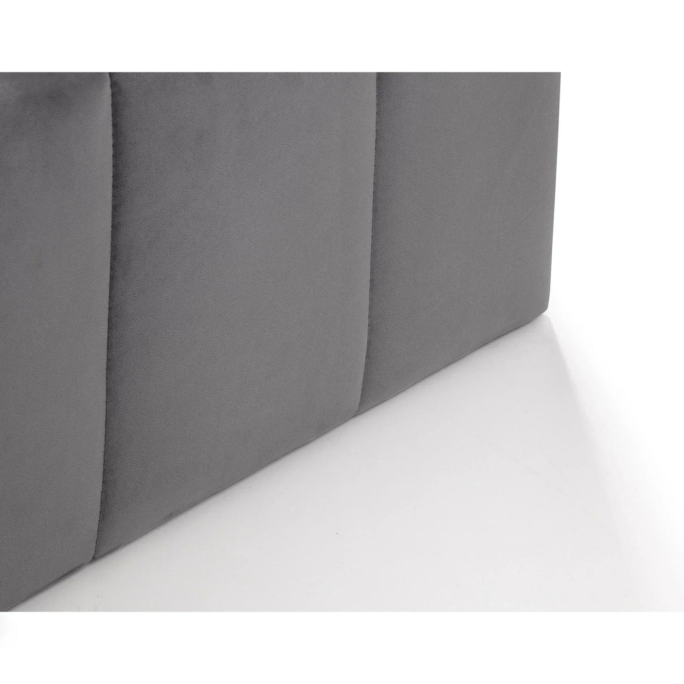 Close up of grey upholstered ottoman bed fabric base panel