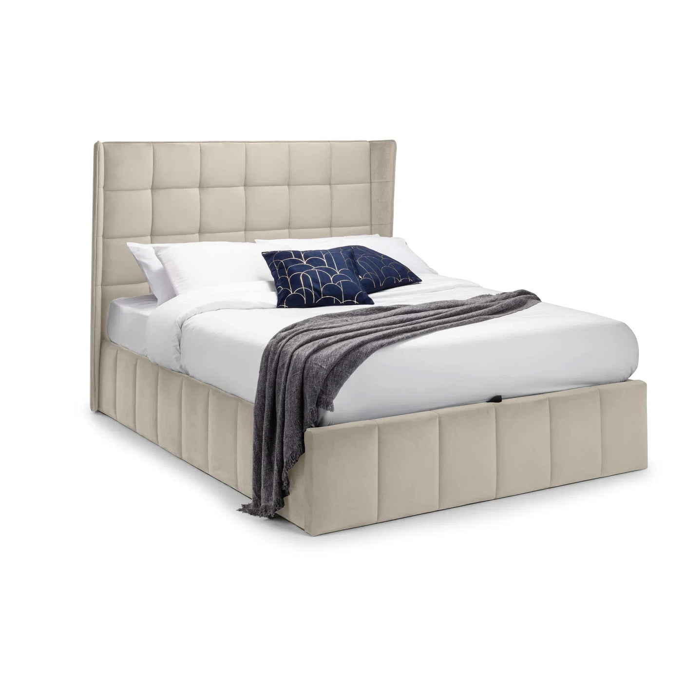 Beige upholstered bed frame with tall square panel headboard and bedding, angled view
