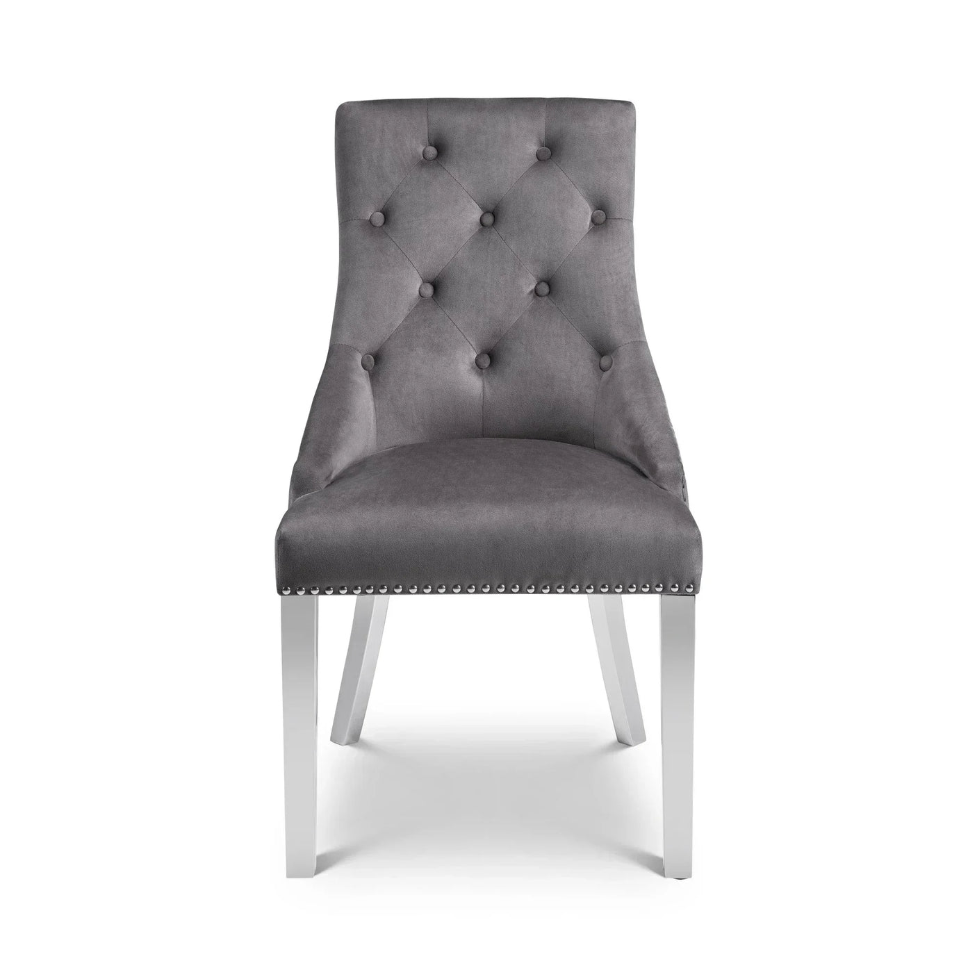 Grey velvet dining chair with button-tufted backrest and chrome legs, front view