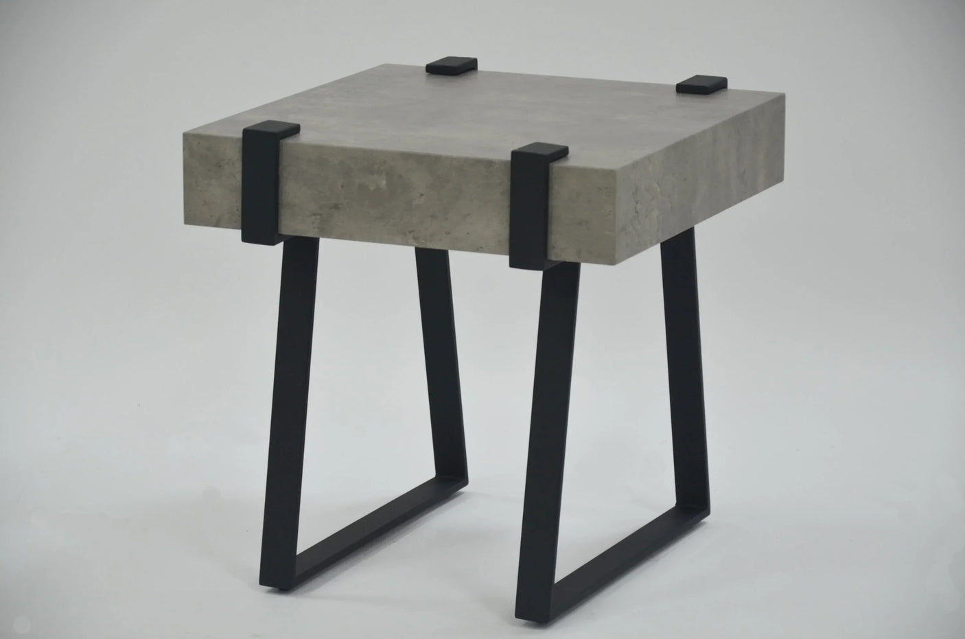 Grey marble lamp table with black metal legs and square modern design on white background