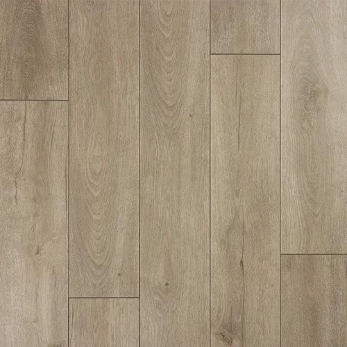 Greige oak laminate flooring with realistic wood grain and matte finish in plank layout