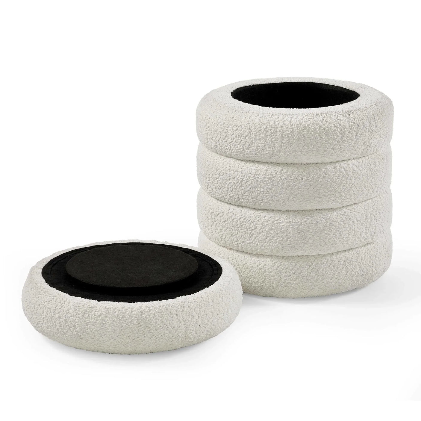 Set of four round boucle seat cushions with black non-slip backing