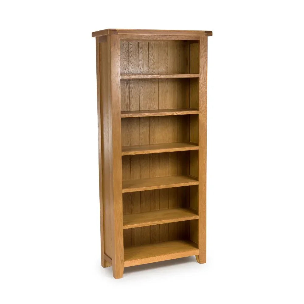 Tall oak bookcase with six wooden shelves and panelled back, angled front view