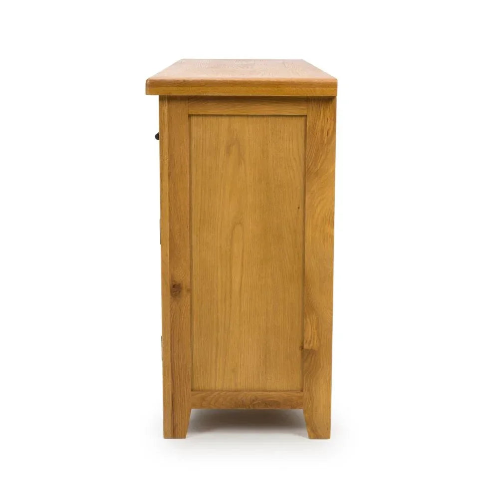 solid oak chest of drawers side view showing wood grain and panel detail