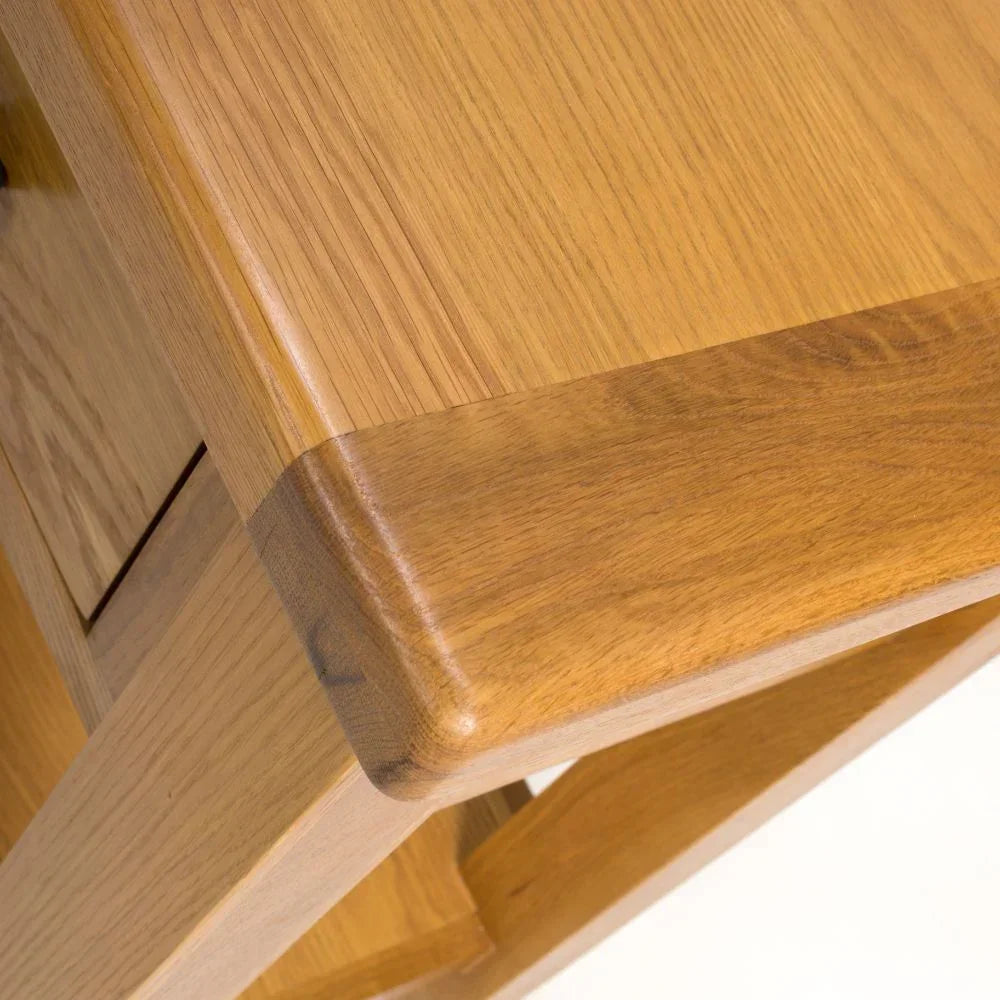 Detail of oak dining table corner with smooth finish and visible wood grain