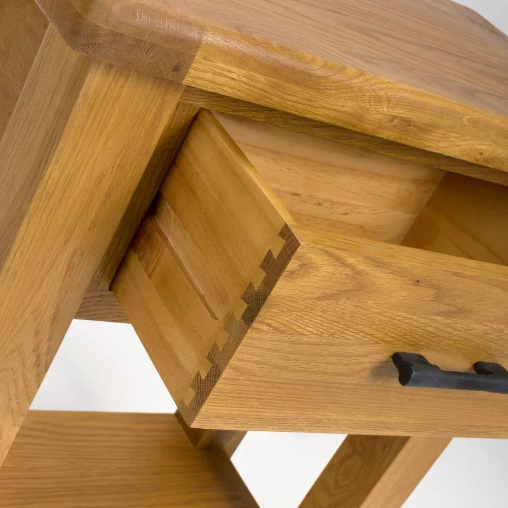 Oak console table corner with dovetail joint and black metal handle detail