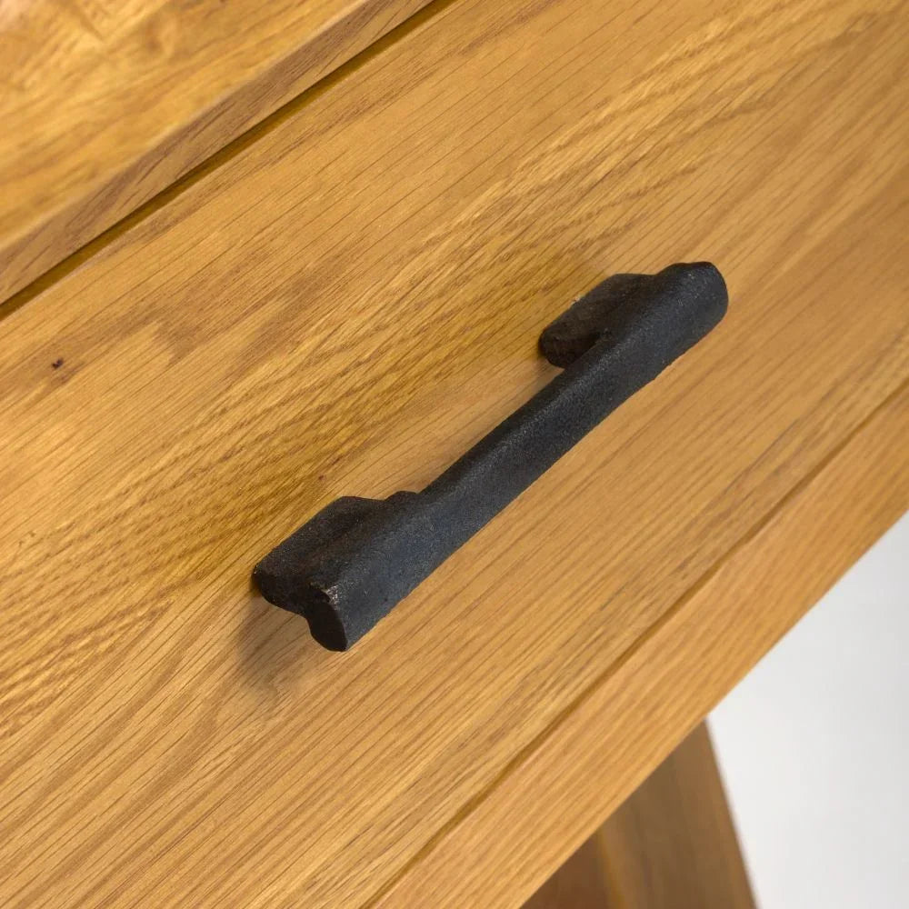 Oak drawer with black metal handle close-up