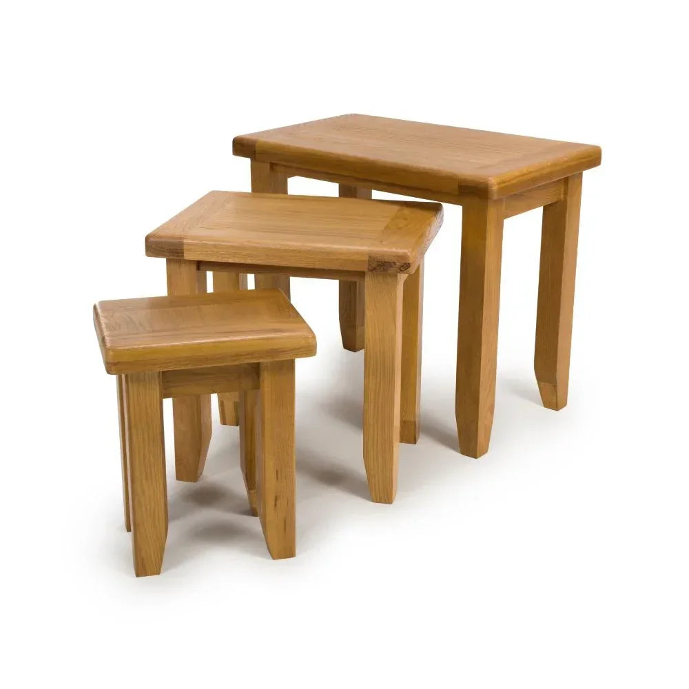 Oak nesting tables set of three in natural wood finish on white background