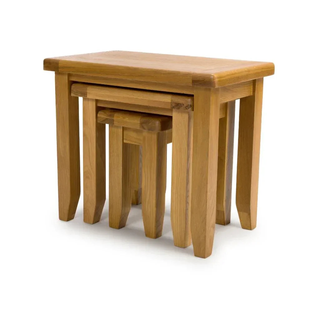 Oak nest of tables set with three stacking tables, natural wood finish, angled view