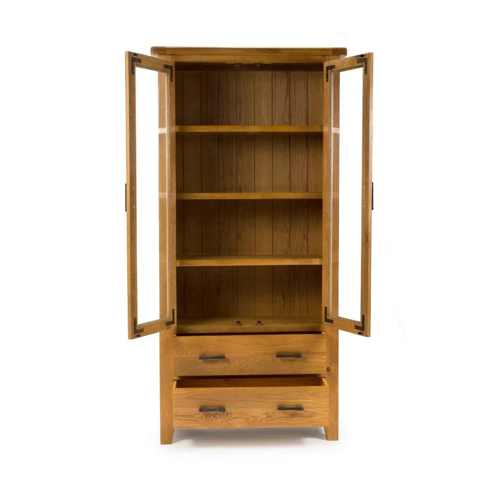 Oak display cabinet with glass doors, three shelves, and two storage drawers front view