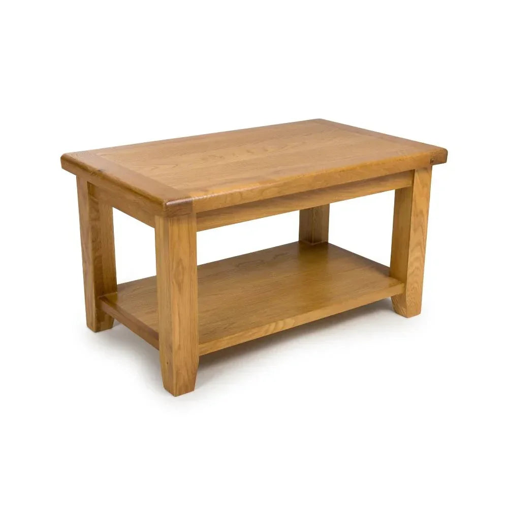 Oak coffee table with lower shelf and rectangular top on white background