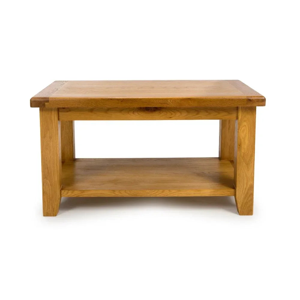 Oak coffee table with lower shelf and rectangular top on white background