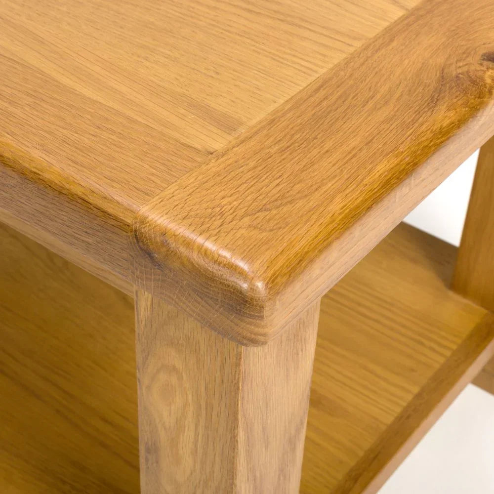 Closeup of oak coffee table corner showing wood grain and smooth finish
