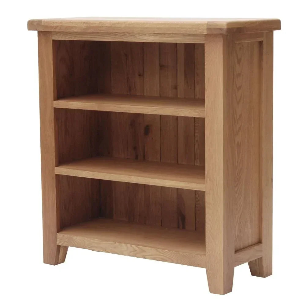 Oak bookcase with three shelves and natural wood finish, shown at an angle