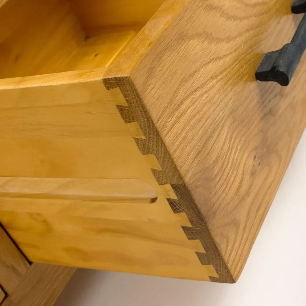Solid oak drawer front with dovetail joints and black metal handle