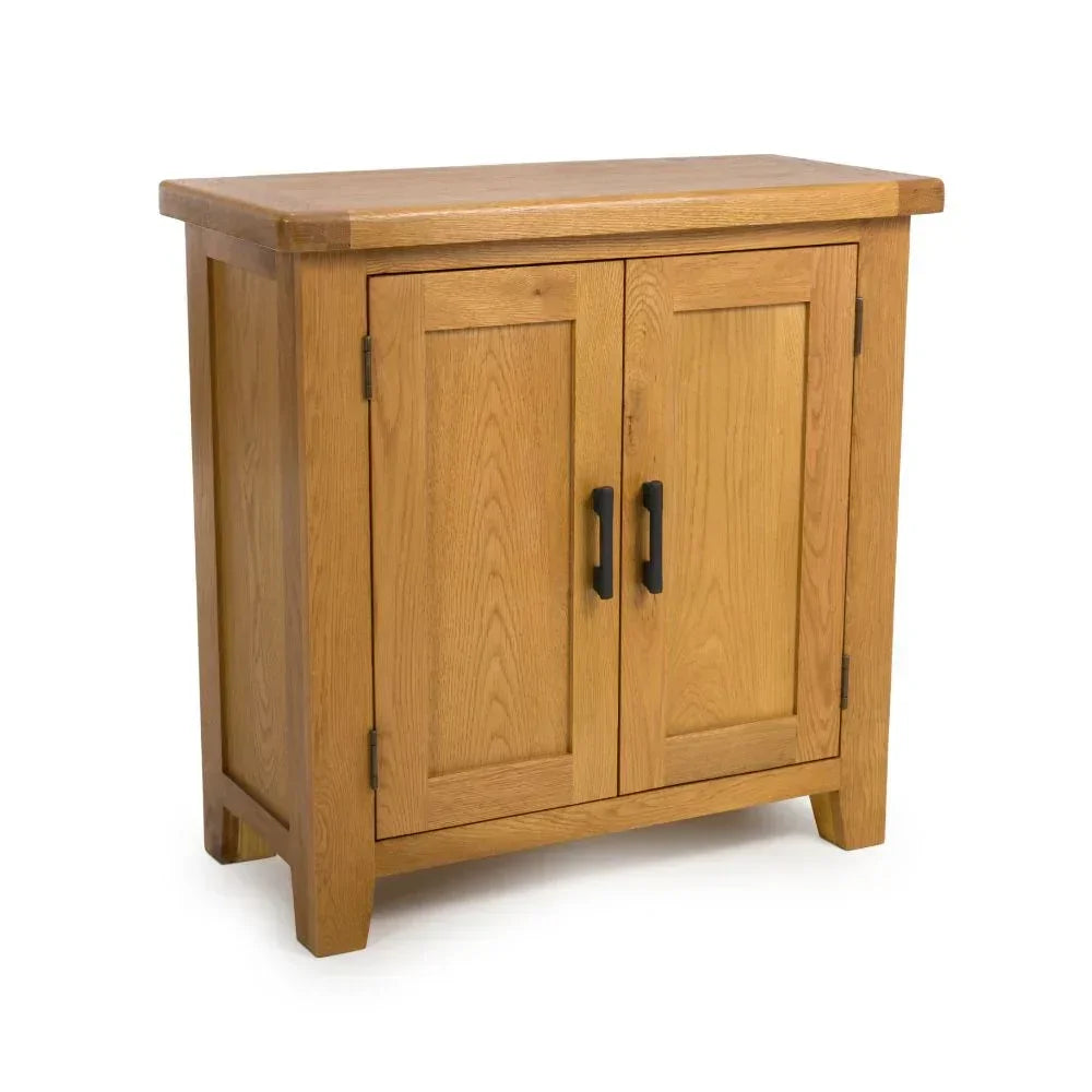 Oak sideboard cabinet with two doors and black metal handles, shown at a three-quarter angle