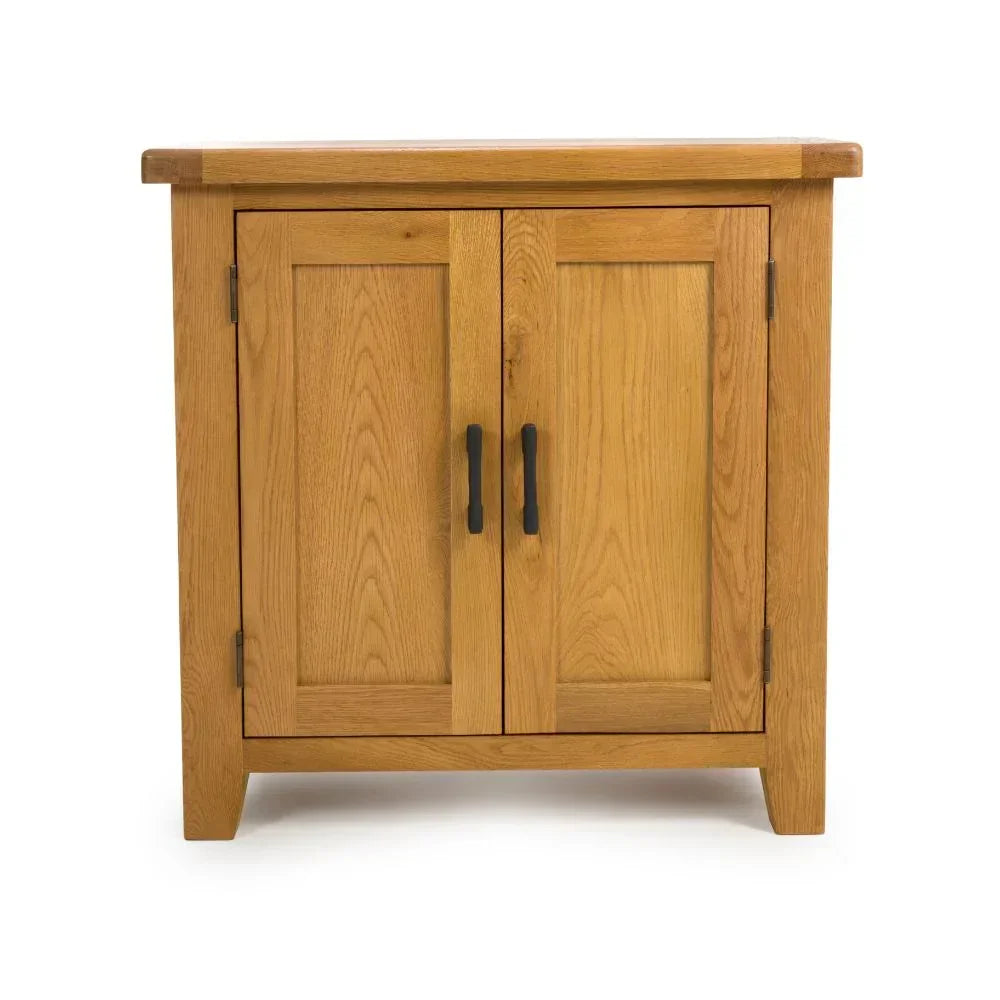 Oak sideboard cabinet with two doors and black handles, photographed from the front